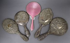 Five assorted silver mounted hand mirrors including pink guilloche enamel and Reynold's Angels.