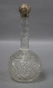 An early 20th century silver topped long necked cut glass globular scent bottle, Miller Bros.