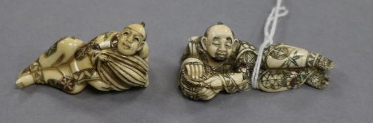 Two Japanese ivory netsuke of reclining figures 6cm