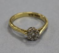 An 18ct gold and illusion set solitaire diamond ring, size O.