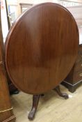A Victorian mahogany circular topped tea table W.101cm