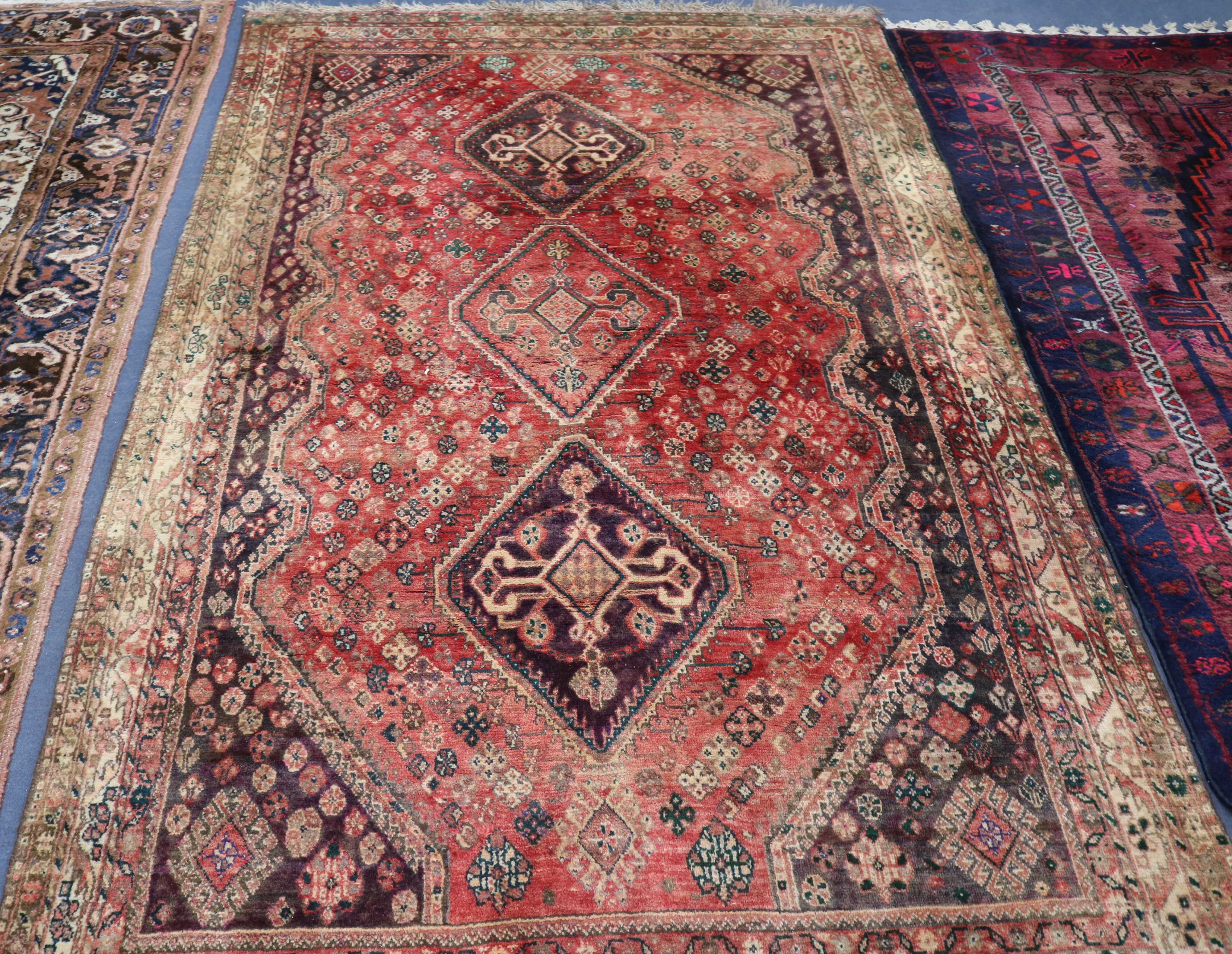 A Persian red ground rug 250 x 165cm