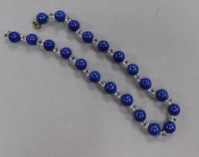 A lapis lazuli and glass bead necklace, 41cm.