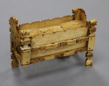 An early 19th century Napoleonic Prisoner of War bone domino set contained in a model crib length