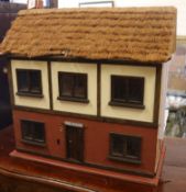 A dolls house with contents W.67cm
