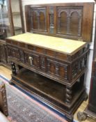 A Spanish walnut buffet, 18th century, having rising top with carved interior over a compartment