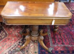 A George IV mahogany and rosewood-banded tea table, having D-shaped folding top, on spiral-turned