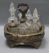 A George IV silver cruet stand, with seven bottles ,three with matching silver mounts, Charles Fox