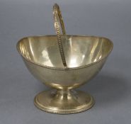 A Victorian engraved silver sugar basket, Robert Harper, London, 1867, width 15cm, 7.5 oz.