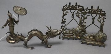 Three Chinese white metal menu holders, including a dragon and pair of frames and a similar Siam