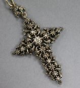 A late Victorian yellow and white metal, rose cut diamond set cross pendant, 52mm.