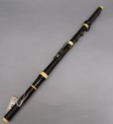 An ivory and silver mounted flute length 67cm