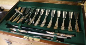 A mahogany canteen of plated flatware