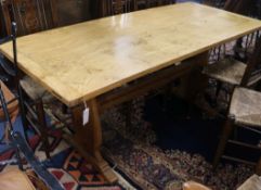 An oak refectory table W.174cm