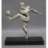 A plated metal footballer on marble base height 19cm