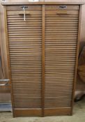 A double tambour shutter filing cabinet W.84cm