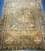 A Persian beige ground rug 185 x 150cm