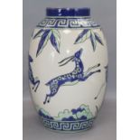 An Art Deco style vase, decorated with antelopes height 28.5cm