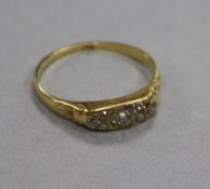 An 18ct gold and six stone diamond half hoop ring, size U.