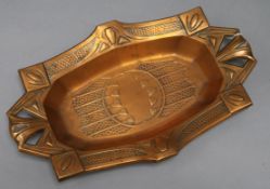 An Arts and Crafts copper dish, Glasgow style length 35cm