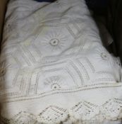 A quantity of pillow cases and a crochet bed cover