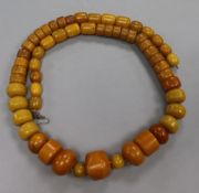 A large string of simulated amber beads, together with some additional beads.