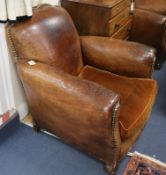 A pair of leather club armchairs