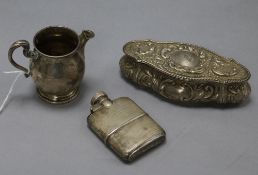 A small George V silver hip flask by Asprey & Co, a Scottish silver cream jug and a repousse