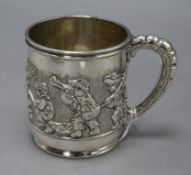 An early 20th century Tiffany & Co silver christening mug, decorated with children at play, import