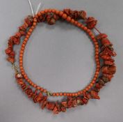 A red coral boulder necklace and a coral bead necklace.