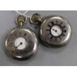 Two silver half hunter pocket watches.