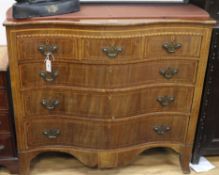 A George III mahogany inlaid chest of serpentine form W.117cm