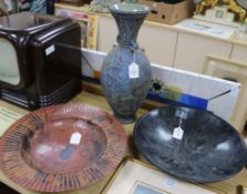 A Studio pottery tall stoneware vase, a black soapstone charger and a large circular patinated