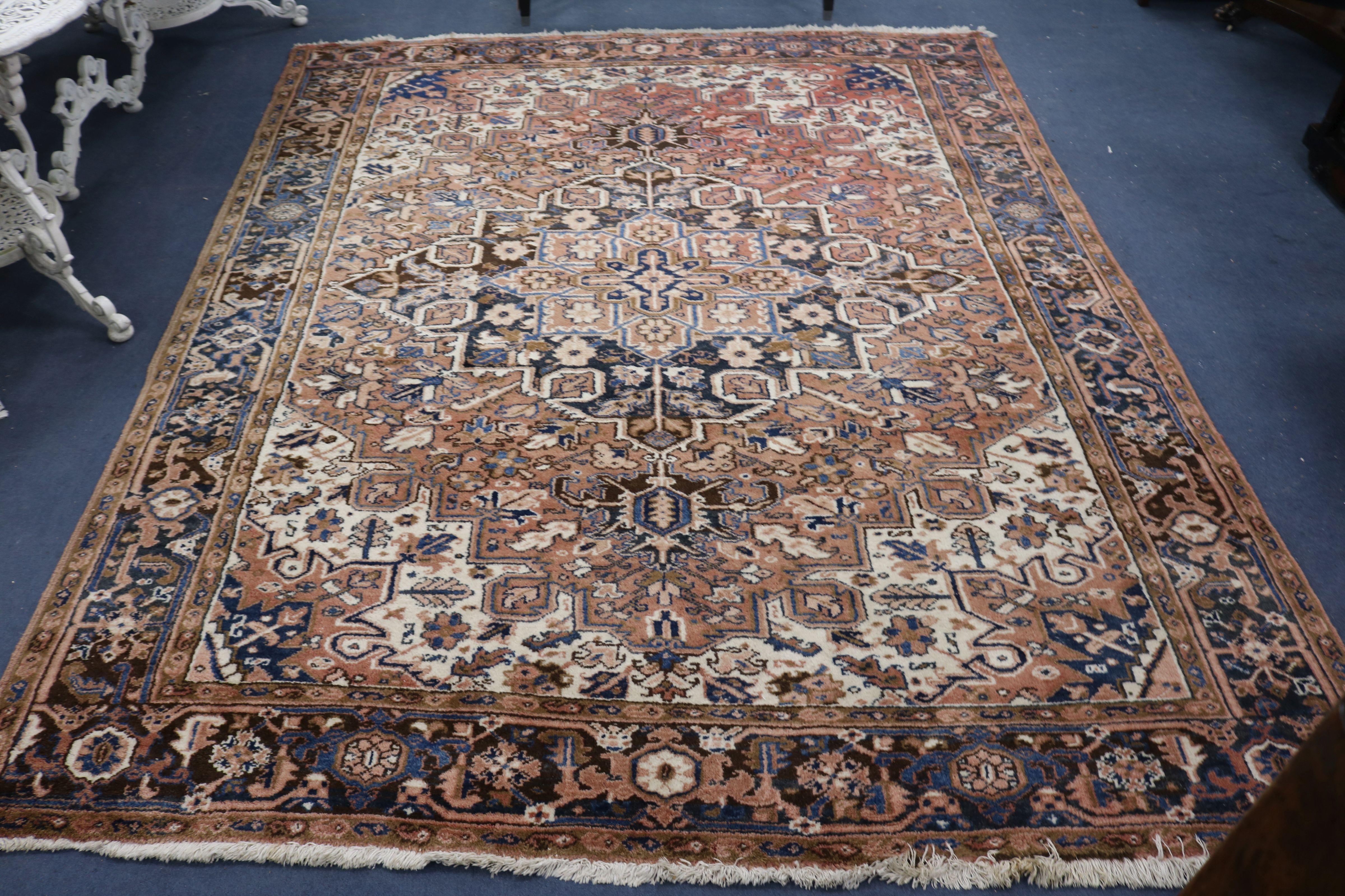 A Persian Kashan cream ground carpet 294 x 234cm