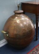 A large pair of copper and brass urns, as lamps