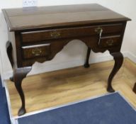 An early 18th century style oak side table W.106cm