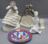 A 1960's Royal Dux nude, a commemorative plate and a figure of birds signed Péaée and one other