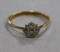 A 1920's 18ct gold, platinum and diamond cluster ring, size O.