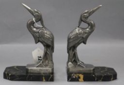 Frecourt. A pair of Art Deco bookends modelled as cranes, on marble bases, signed height 17cm