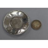 A coin inset tray and another coin