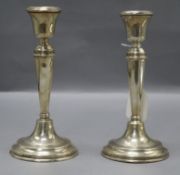 A pair of George V silver candlesticks by William Hutton & Sons, weighted, 21.2cm.