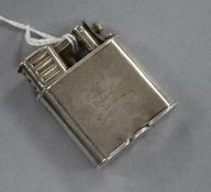 A Dunhill white metal lighter, with engraved crest, 50mm.