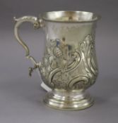 A silver plated embossed and engraved baluster mug.