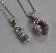 A 9ct white gold, diamond and aquamarine three-stone pendant on chain and a similar pale amethyst