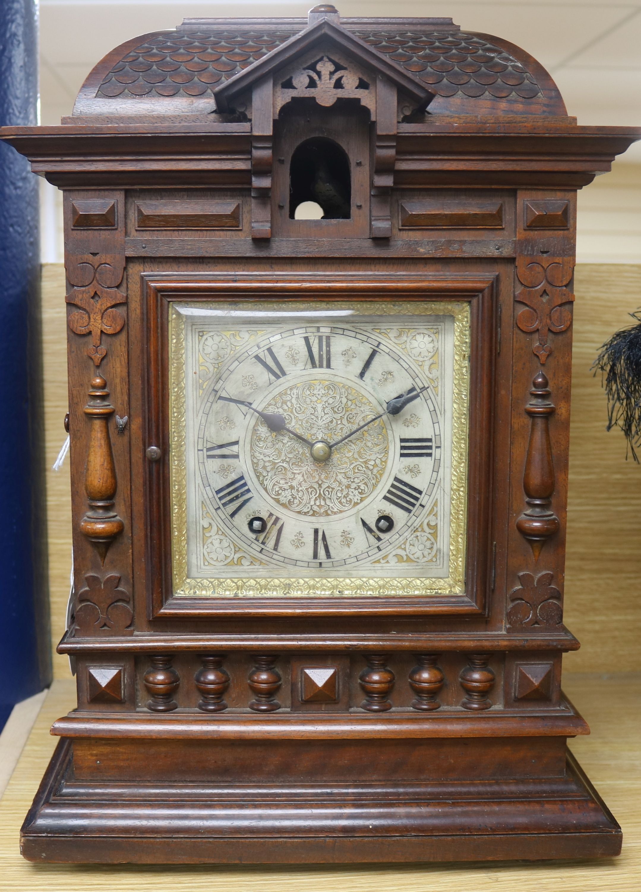 A late 19th century German mahogany cuckoo clock, of architectural form, the cuckoo appearing