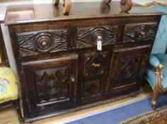 A Spanish carved walnut sideboard, 19th century fitted three short drawers over three further
