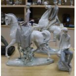 Three Lladro figures including horses and riders and a seated boy tallest 49cm