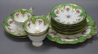 A late Victorian green border floral painted part tea service