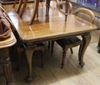 A 1920's mahogany extending dining table W.180cm extended