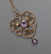 A 9ct gold and amethyst set open work pendant, on a 9ct gold fine link chain, pendant 38mm.